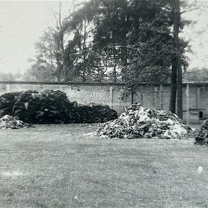 Dachau - American photograph of piles of clothing near Baracke X